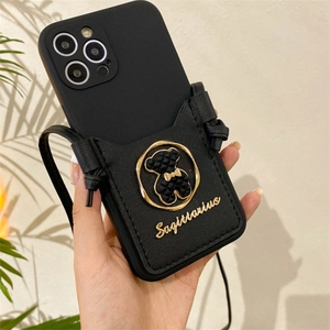 Crossbody black leather phone card holder with gold bear and Sagittarius strap detail