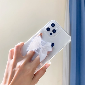 White fabric bow phone griptok holder on a clear case for hand grip support