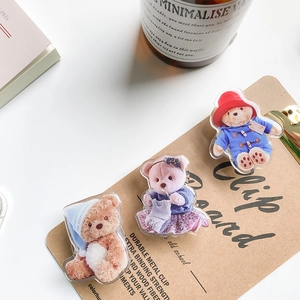 Detail of cute acrylic bear phone grips with vintage Paddington style and floral motifs