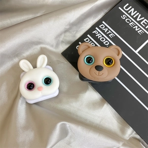 Macro shot of cute cartoon rabbit and bear phone grip stands with foldable mirror details