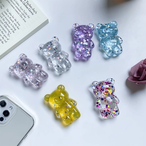 Detailed view of colorful glitter resin bear phone sockets in diverse vibrant finishes