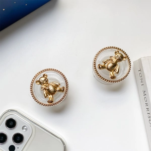 Transparent popsocket stand with 3D golden bear relief and elegant beaded metallic border