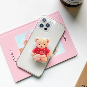 Detail of cute 3D brown plush bear grip attached to a clear protective phone case