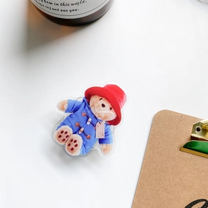 Macro shot of Paddington Bear acrylic phone grip featuring classic red hat and blue coat