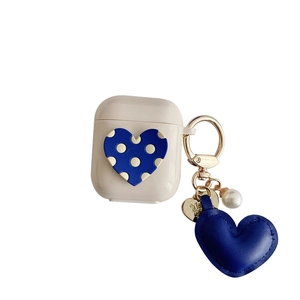 Beige AirPods case with blue heart pattern and matching leather heart keychain pendant