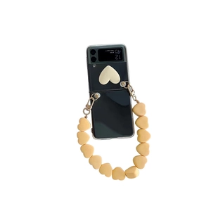 Clear case for Samsung Z Flip3 with cream matte heart and yellow beaded wrist strap