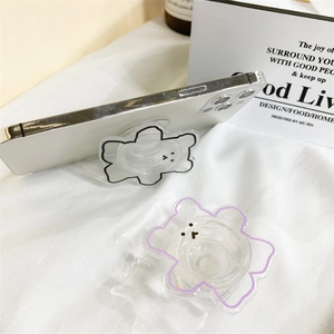 Gros plan de supports de téléphone ours en acrylique au design minimaliste noir et violet
