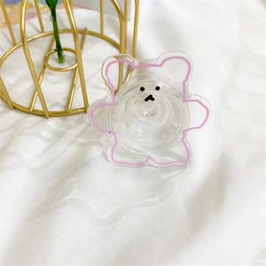 Détail du support de téléphone ours transparent mignon avec contours roses