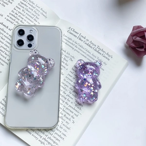 Clear silicone phone case with two purple glitter resin bear pop-up sockets