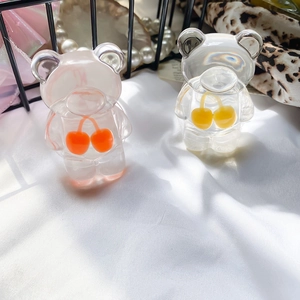 Detail of cute bear phone grip sockets in matte pink and transparent resin with cherry icons
