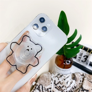 Détail du support de téléphone ours mignon avec contours noirs et détails en strass chic