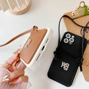 Crossbody phone case with card holder and lanyard, featuring rhinestone metal accents