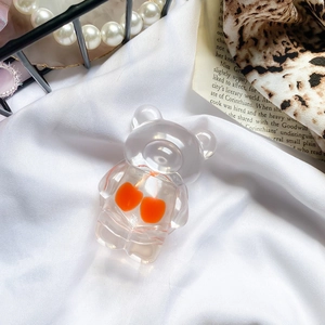 Detail of cute transparent bear phone grip with cherry design on a stylish aesthetic background