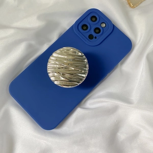 Detailed view of silver water ripple phone socket on dark blue protective case