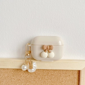 Creamy silicone case for AirPods with cherry bow design and elegant pearl keychain