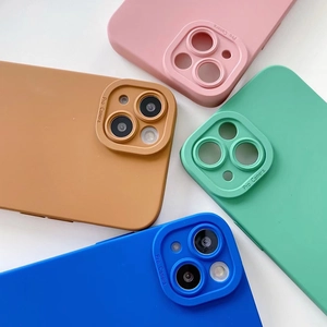 Detailed view of silicone phone cases in pink, brown, mint green, and blue matte finish