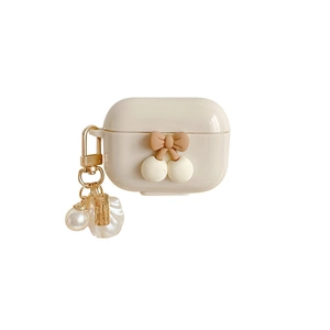 Creamy white AirPods Pro case with elegant 3D bow and pearl keychain accessory