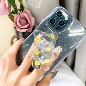 Cute transparent bear phone socket holder with yellow flowers on a glitter case