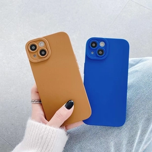 Detail view of pro camera protection on matte silicone iPhone case in brown and blue