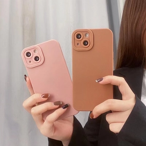Detail of matte pink and brown silicone cases with Pro Camera lens protection covers