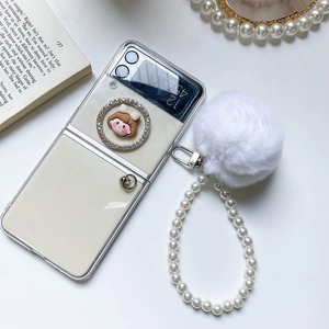 Detail of cream Samsung Z Flip case with pearl strap, pom-pom and cute girl relief