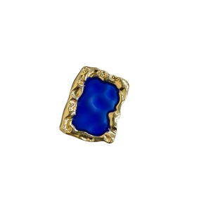 Artistic Klein blue metal phone grip with retro wave-textured gold frame for a unique style