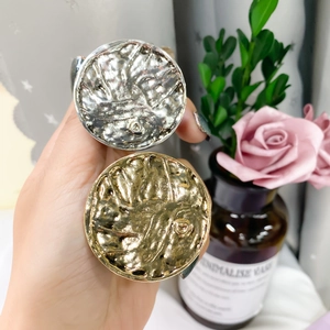 Macro detail of metallic round phone sockets with retro textured gold and silver finish