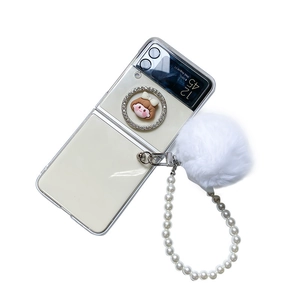 Transparent Samsung Galaxy Z Flip case with pearl strap, rhinestone ring and white fur pompom