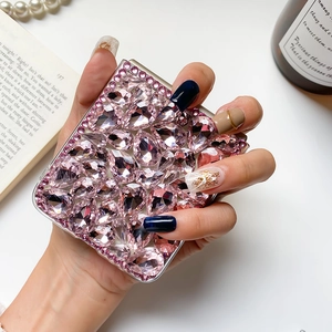Detailed view of pink teardrop rhinestones on a luxury Samsung Z Fold6 phone case