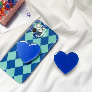 Blue heart-shaped phone socket on a retro argyle pattern protective case