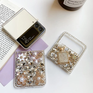 Detail of luxury rhinestone bear and pearl flower on a Samsung Z Flip phone case