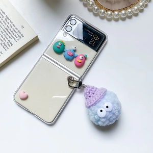 Samsung Z Flip case with cute cartoon monster charms and blue plush keychain accessory
