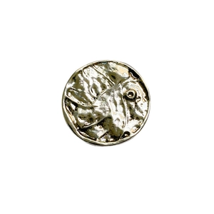 Retro round electroplated metal phone socket with vintage hammered texture on white background