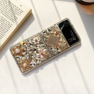 Detail of luxury Samsung Z Flip case with rhinestones, pearl flowers and perfume decor