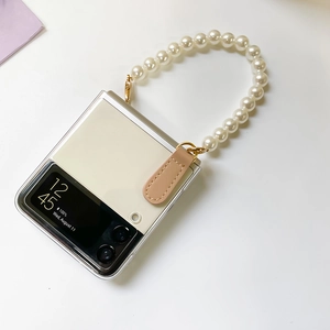 Detail of Galaxy Z Flip case featuring a luxurious large pearl crossbody chain strap
