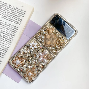 Close-up of glittery Samsung Galaxy Z Flip case with rhinestones and pearl flowers