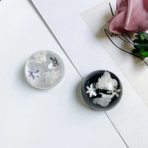 Close-up of glittery snowflake and cloud patterns inside round phone grip resin sockets
