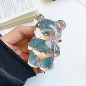 Macro shot of a transparent resin bear grip showing its glossy finish and bubble details