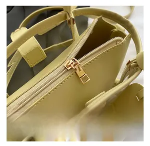 Detailed macro view of golden zipper and hardware on a stylish PU leather bucket bag