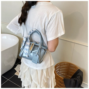 Light blue transparent PVC jelly bucket bag with stylish blue checkered silk scarf detail