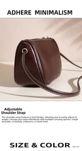 Detail of adjustable knotted strap on dark brown pebble leather crossbody bag