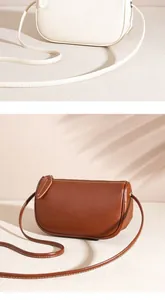 Detail showing smooth leather texture and stitching of minimalist crossbody bags in brown and white