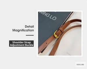 Detail eines braunen Leder-Schultergurts mit verstellbarer goldener Schnalle für Taschen