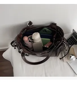 Top view of spacious interior of dark brown tote bag showing large storage capacity