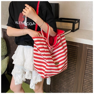 Detail shot of the large capacity canvas tote bag with red and white horizontal stripes