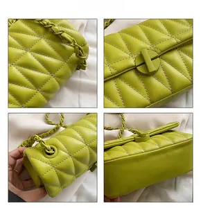 Detail view of neon yellow quilted leather texture and chain strap on shoulder bag