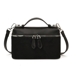 Fashionable black square crossbody bag with dual-texture finish and silver zip closure