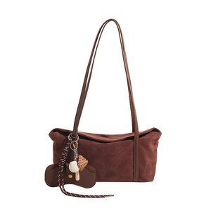 Retro brown suede tote bag with long shoulder straps and sporty baseball charm pendants