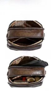 Detail view of large capacity brown leather crossbody bag with multiple zip compartments