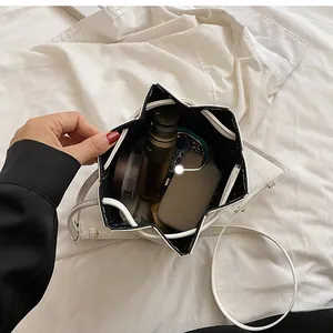 Top view of star-shaped folding white bucket bag showing inner space for cosmetics